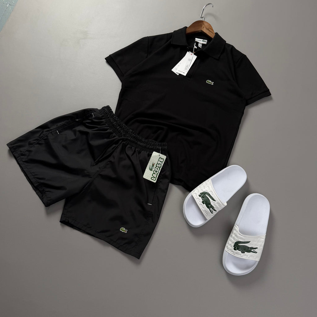 Lacoste Erkek Siyah Yazlık Kombin Seti – Siyah Polo Yaka Tişört, Siyah Deniz Şortu ve Beyaz Terlik