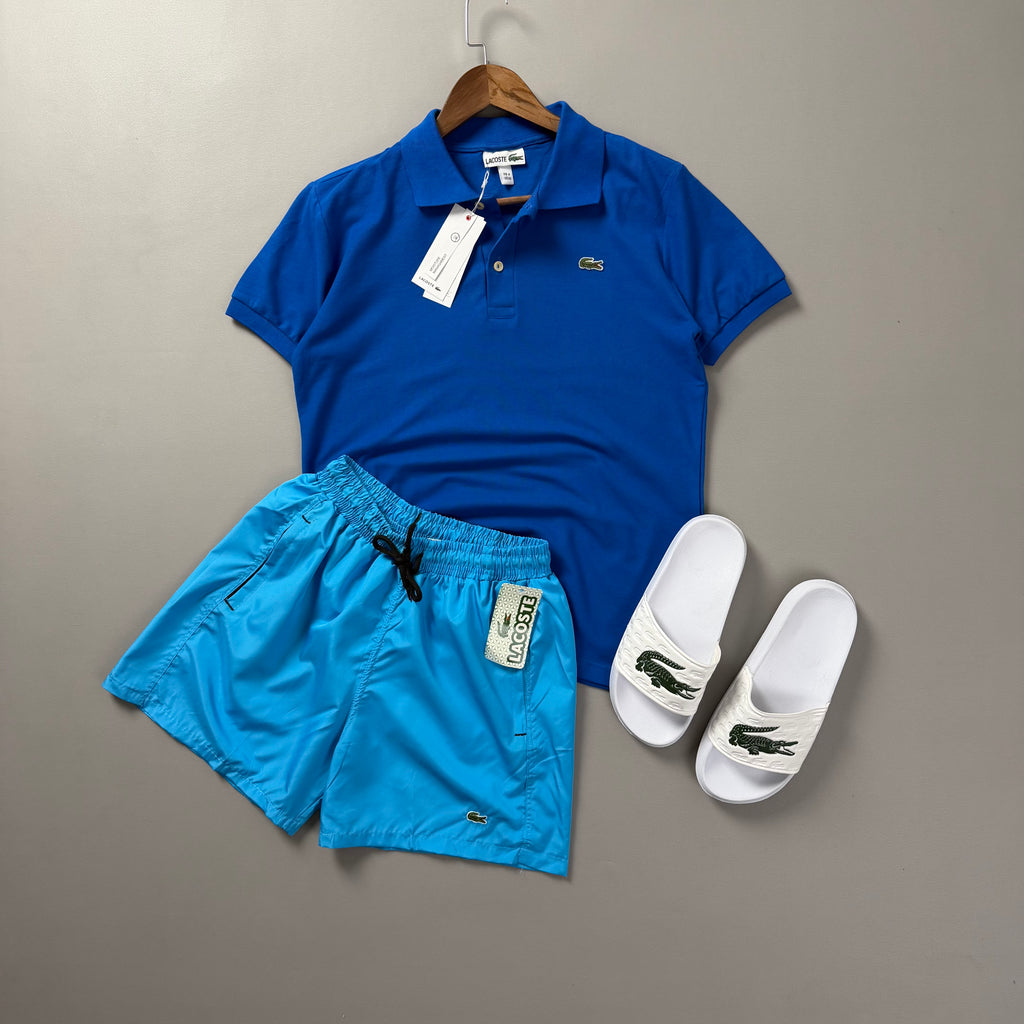 Lacoste Erkek Saks Mavi & Turkuaz Yazlık Kombin Seti – Polo Tişört, Deniz Şortu ve Terlik